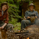 two woodswoman sitting at the fire
